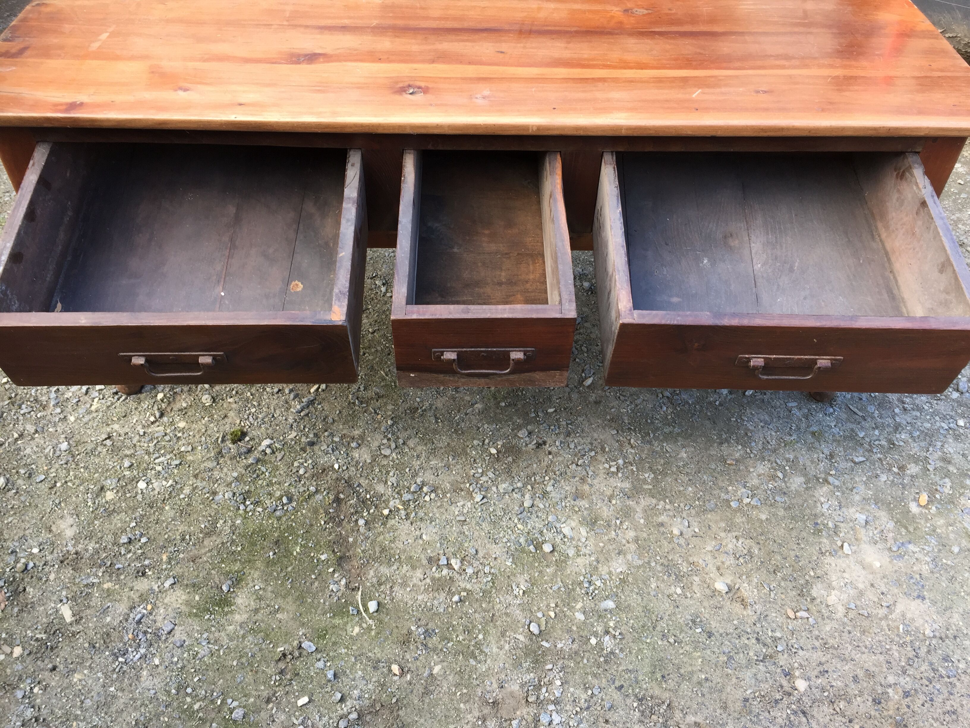 Old farmhouse table with cherry and chestnut panels with 3 drawers.