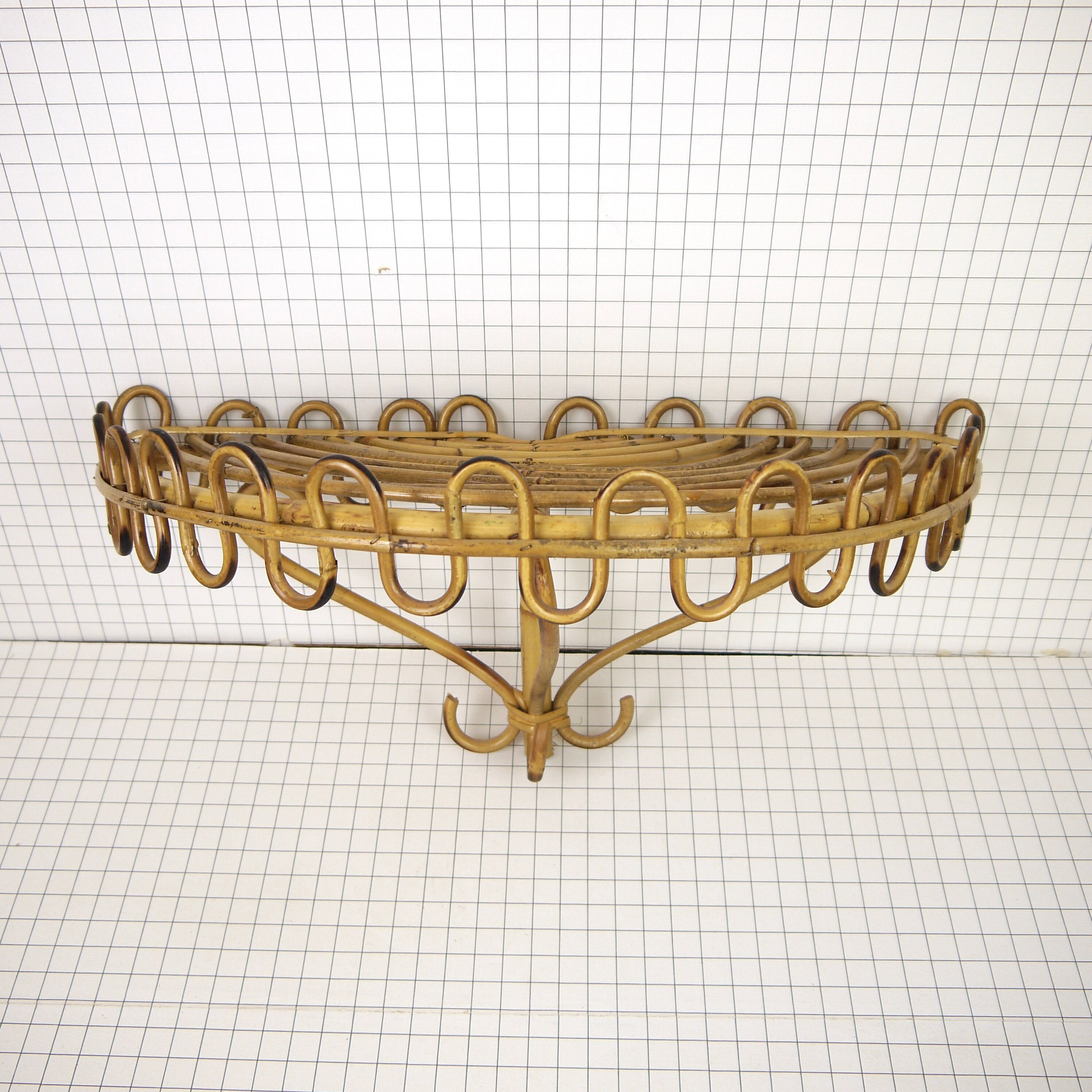 Half-moon rattan shelf and coat holder