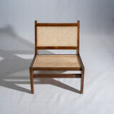Reclined armchair in canned teak in natural wood