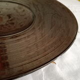 Round flared dish in ribbed brown glass
