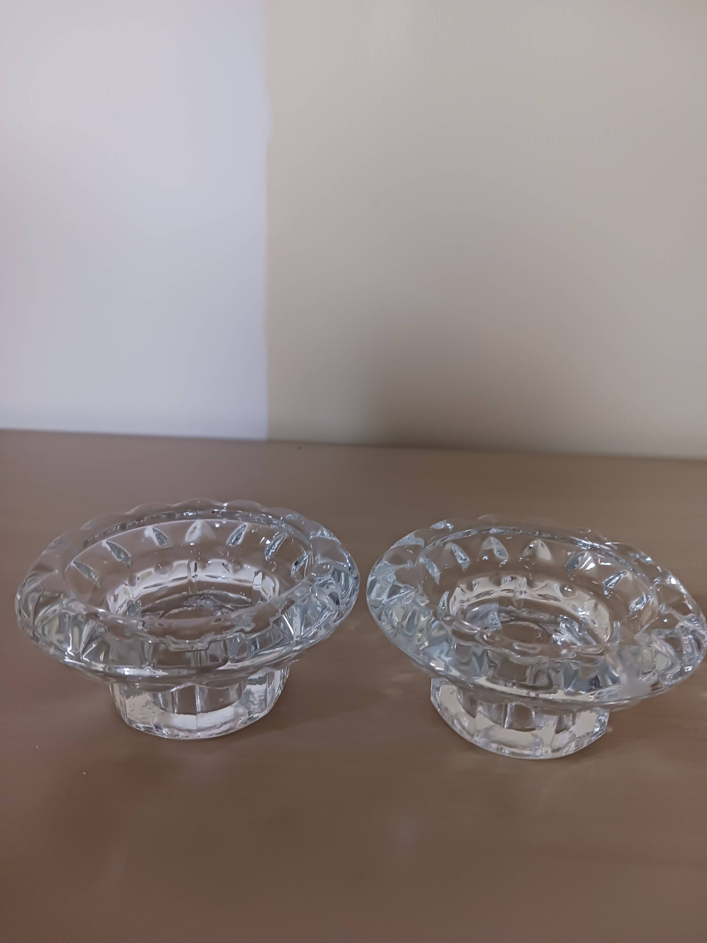 Moulded glass candle holders.