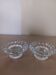 Moulded glass candle holders.
