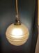 Frosted glass lamp with golden trims