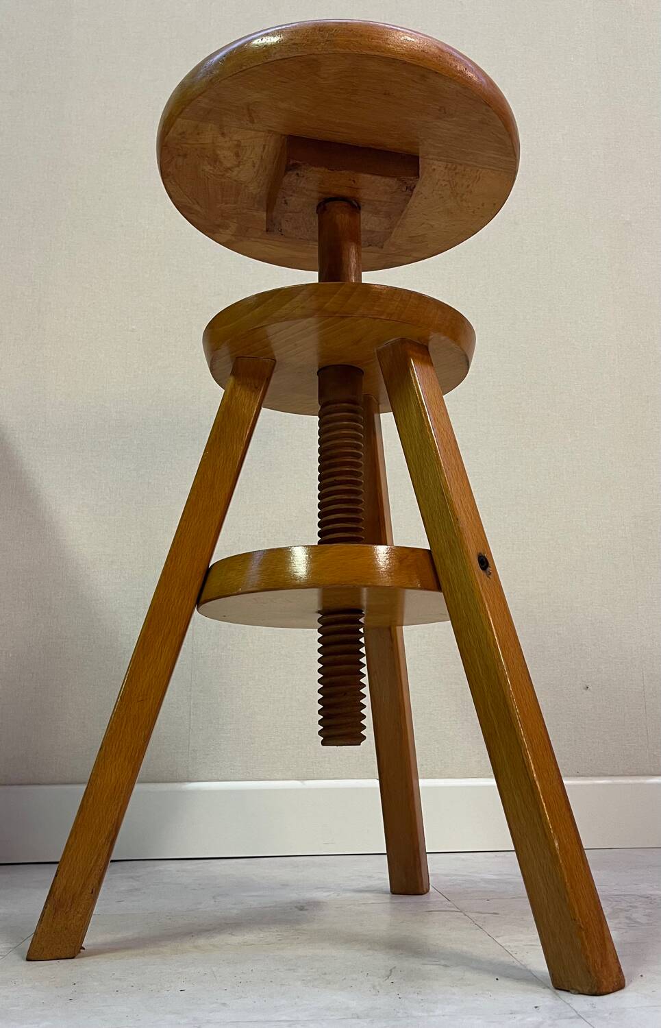 Adjustable and swivel wooden stool
