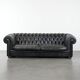 Black chesterfield 3-seater sofa made of cowhide leather in English style