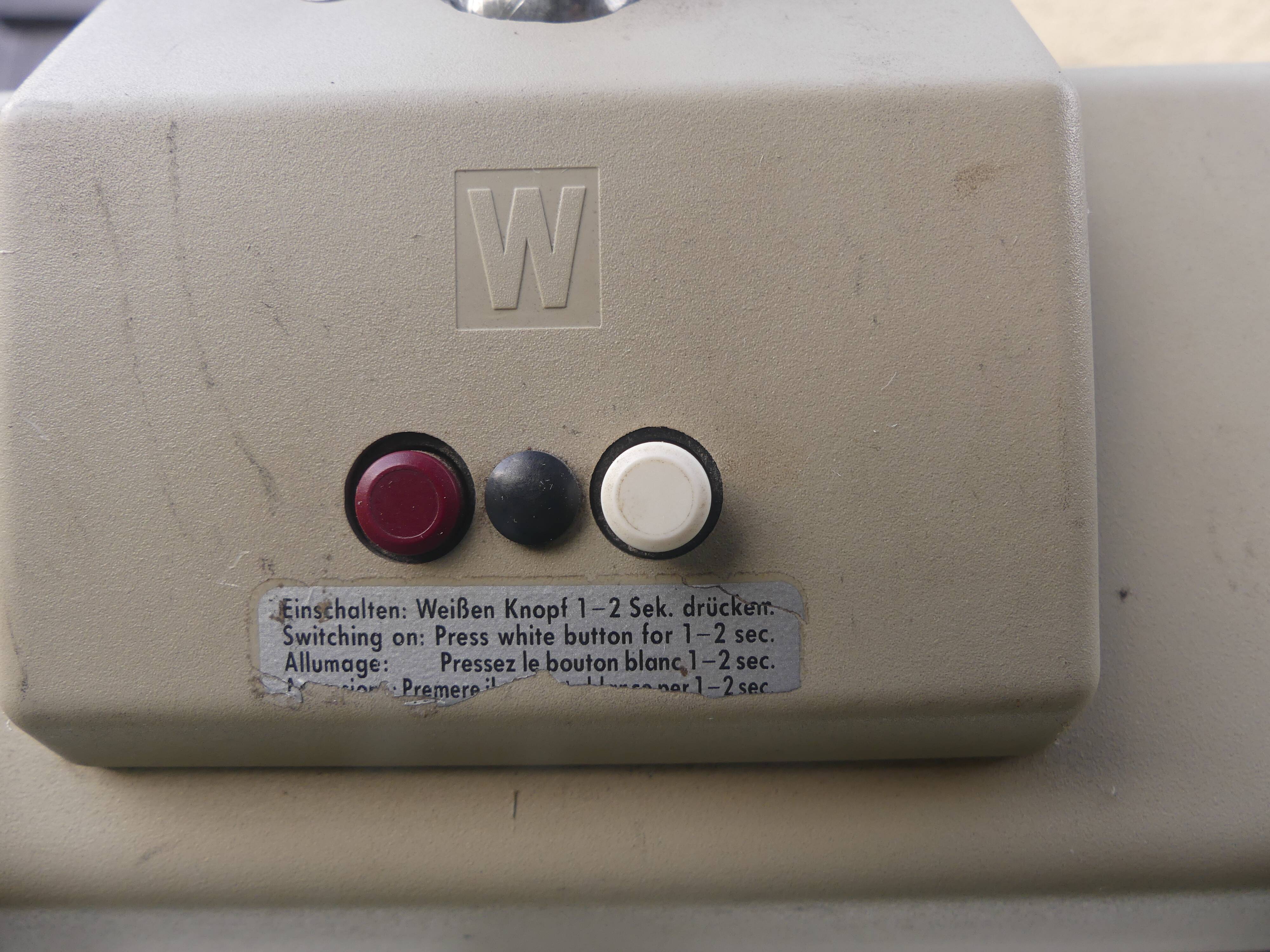 WALDMANN articulated workshop lamp with two industrial clamp arms for architects.