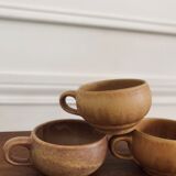 Three cups made of ancient sandstone