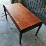 Vintage coffee table with Scandinavian rise and fall system in teak