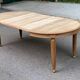 Large stripped solid oak dining table in Louis XVI style with 3 extensions.