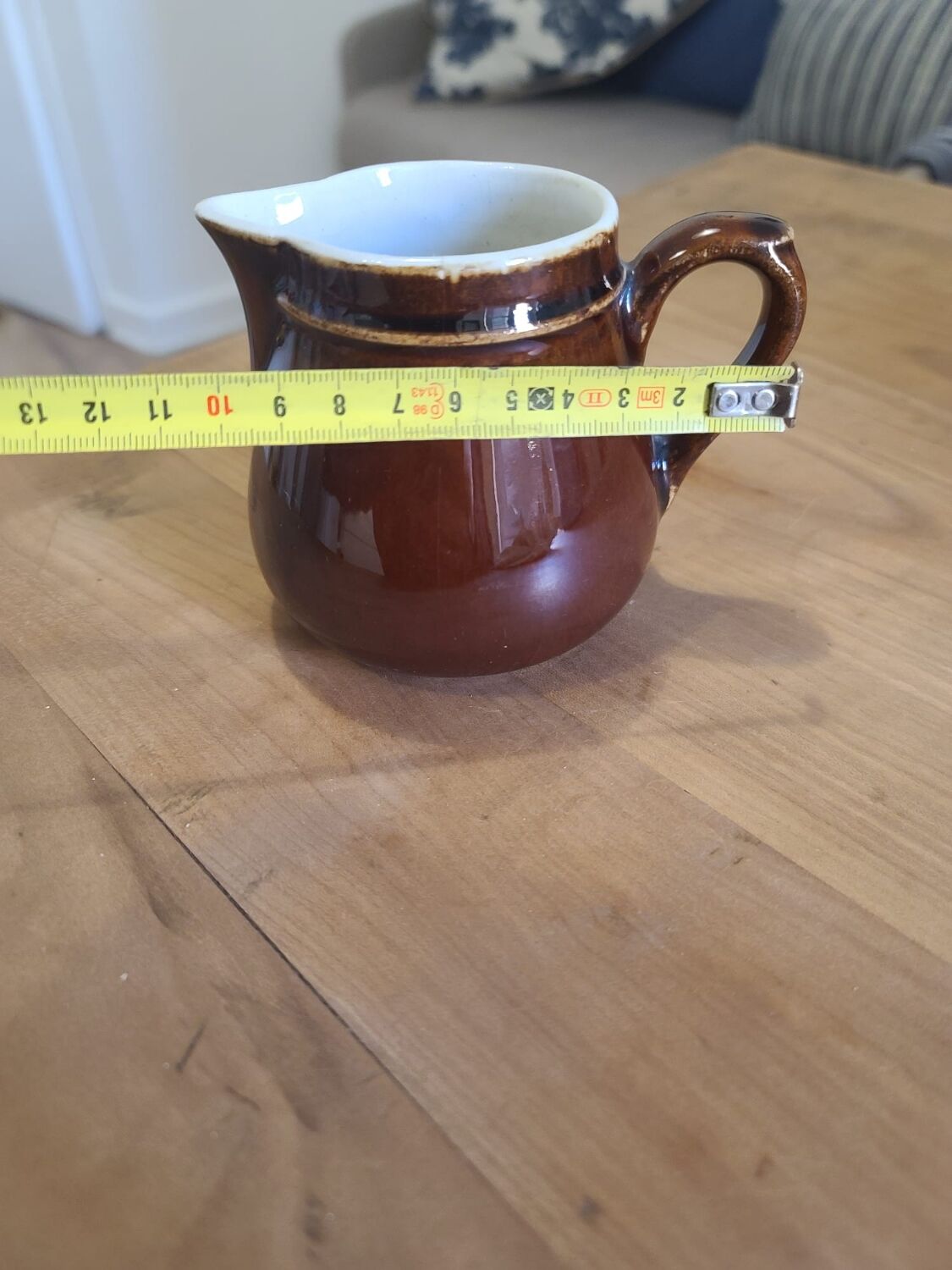 Brown ceramic milk jug