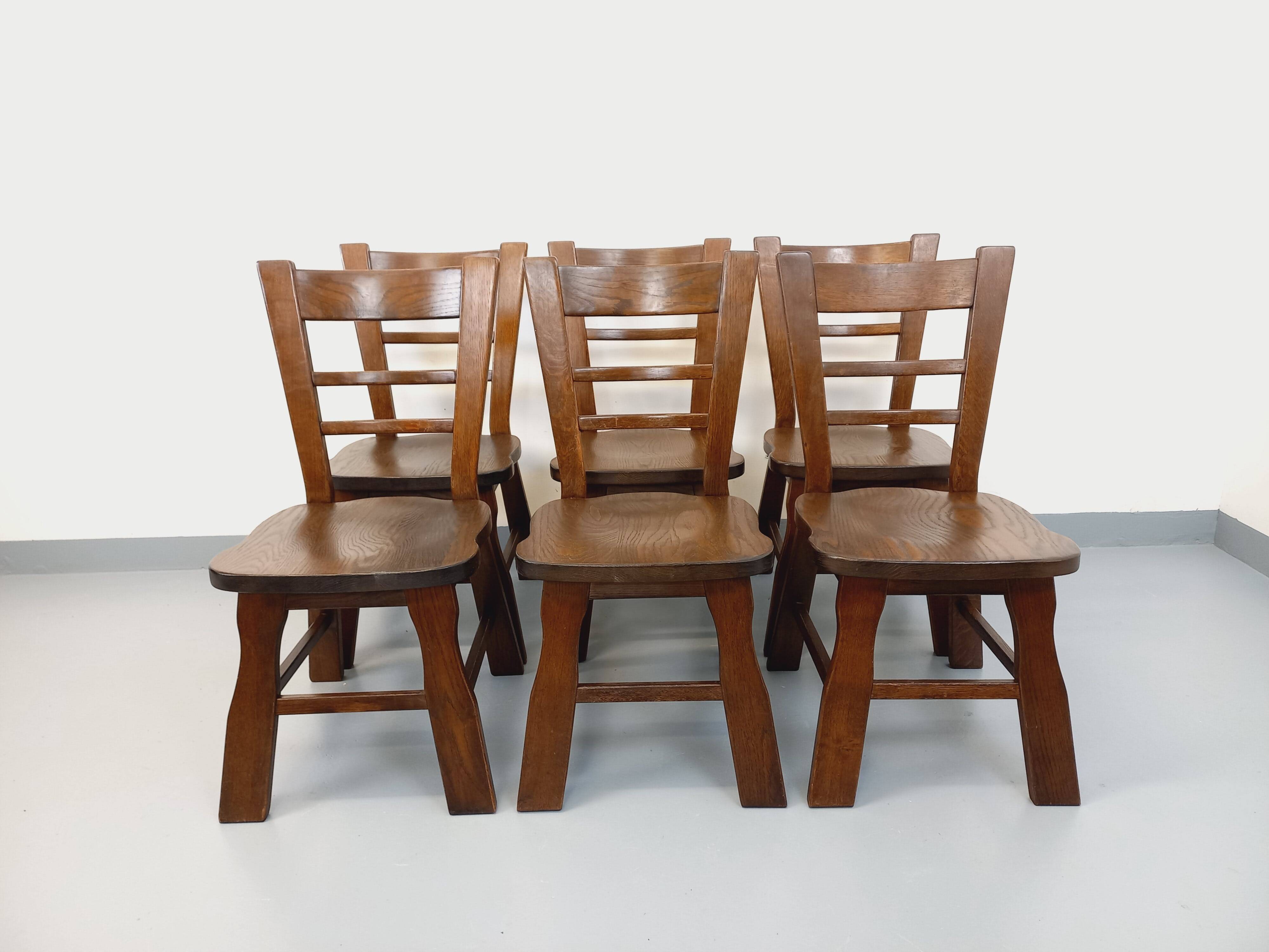 Set of 6 vintage brutalist oak chairs from the 1950s.