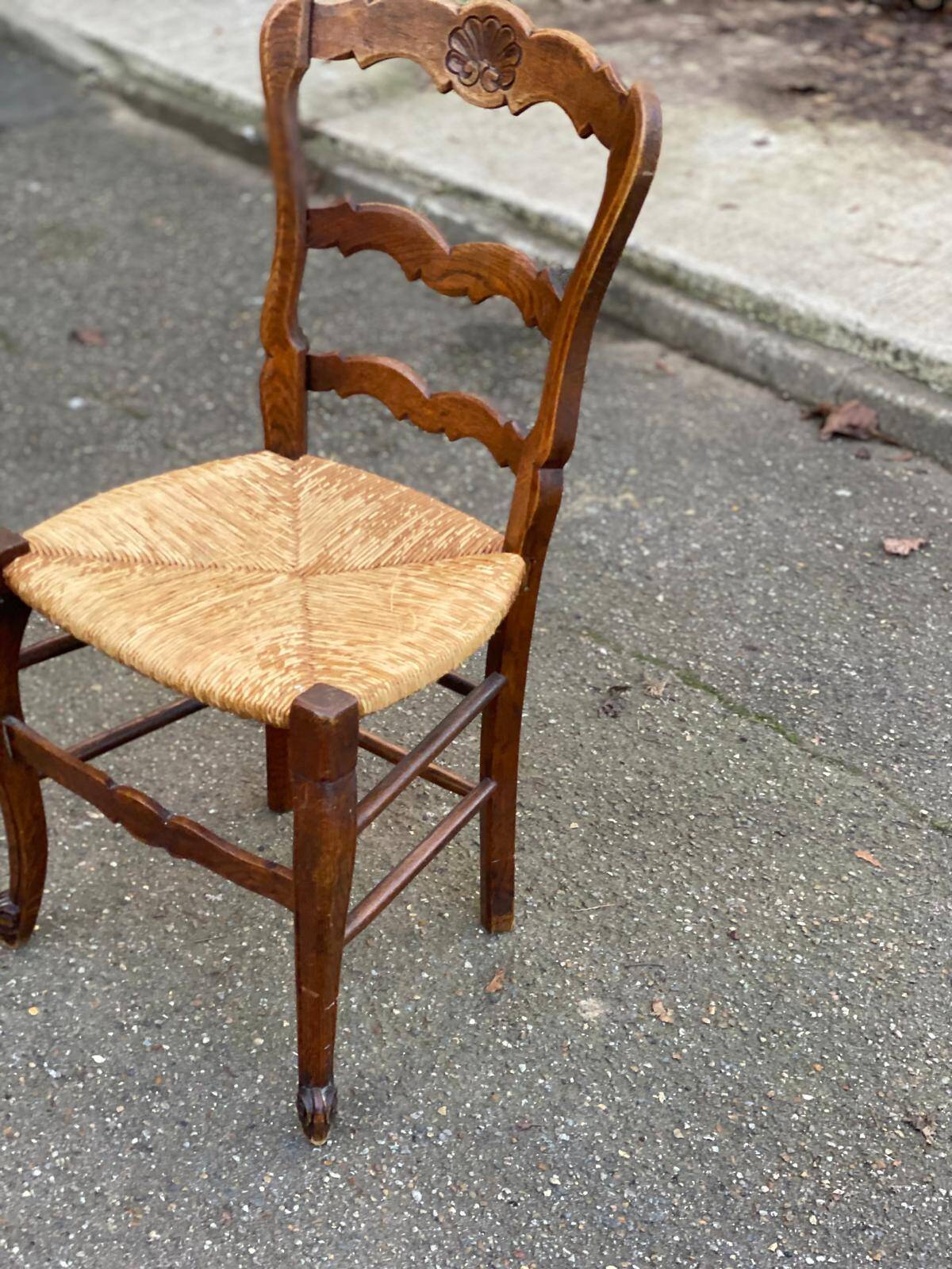 Louis XV 18th century solid wood dining chair with a straw seat.