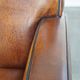 Art Deco design sheepskin leather armchair with a stunning patina
