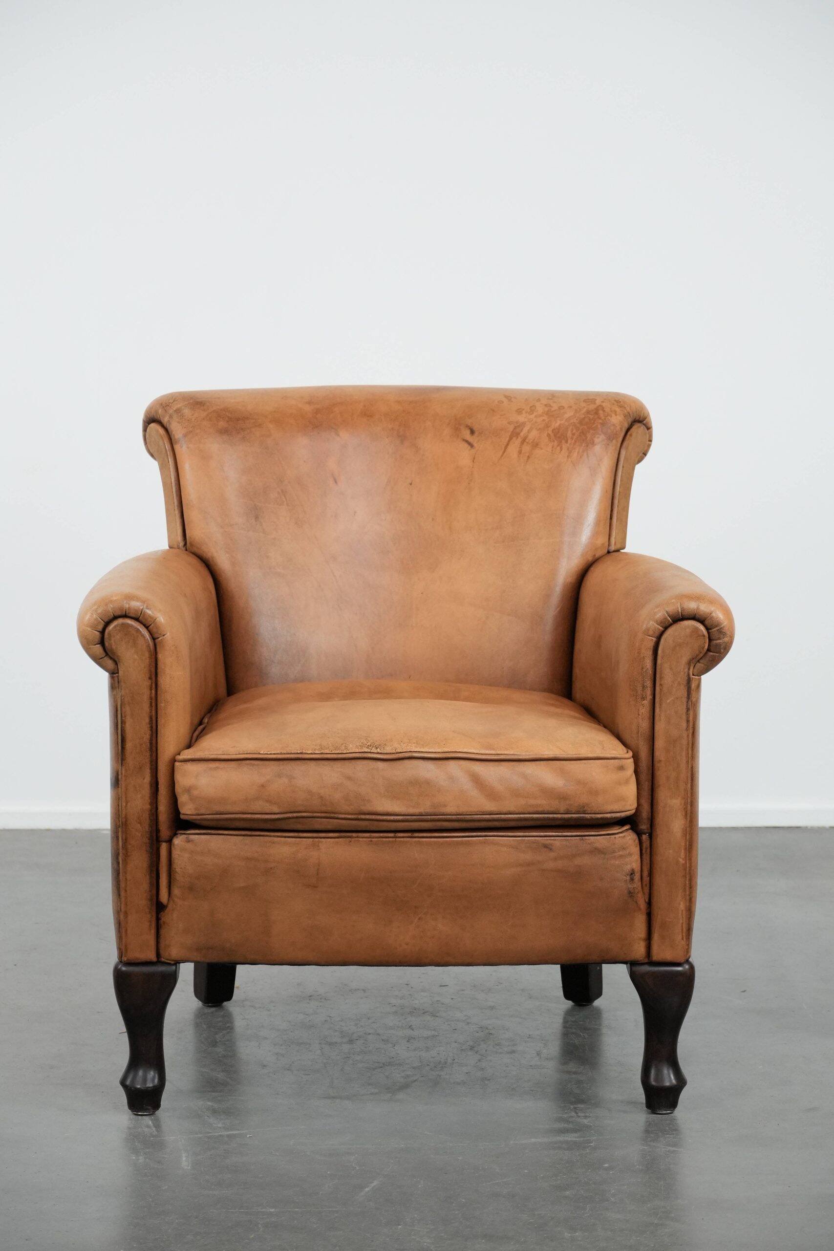 Beautiful subtle vintage sheepskin armchair with elegant legs