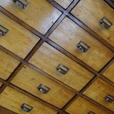 School cabinet bank of vintage Dutch drawers in mid-twentieth century pine