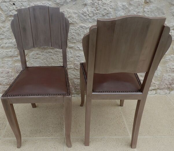 Two restyled leather-style chairs with nails