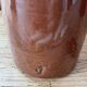 Old hot water bottles in glazed sandstone
