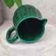 Old green jug