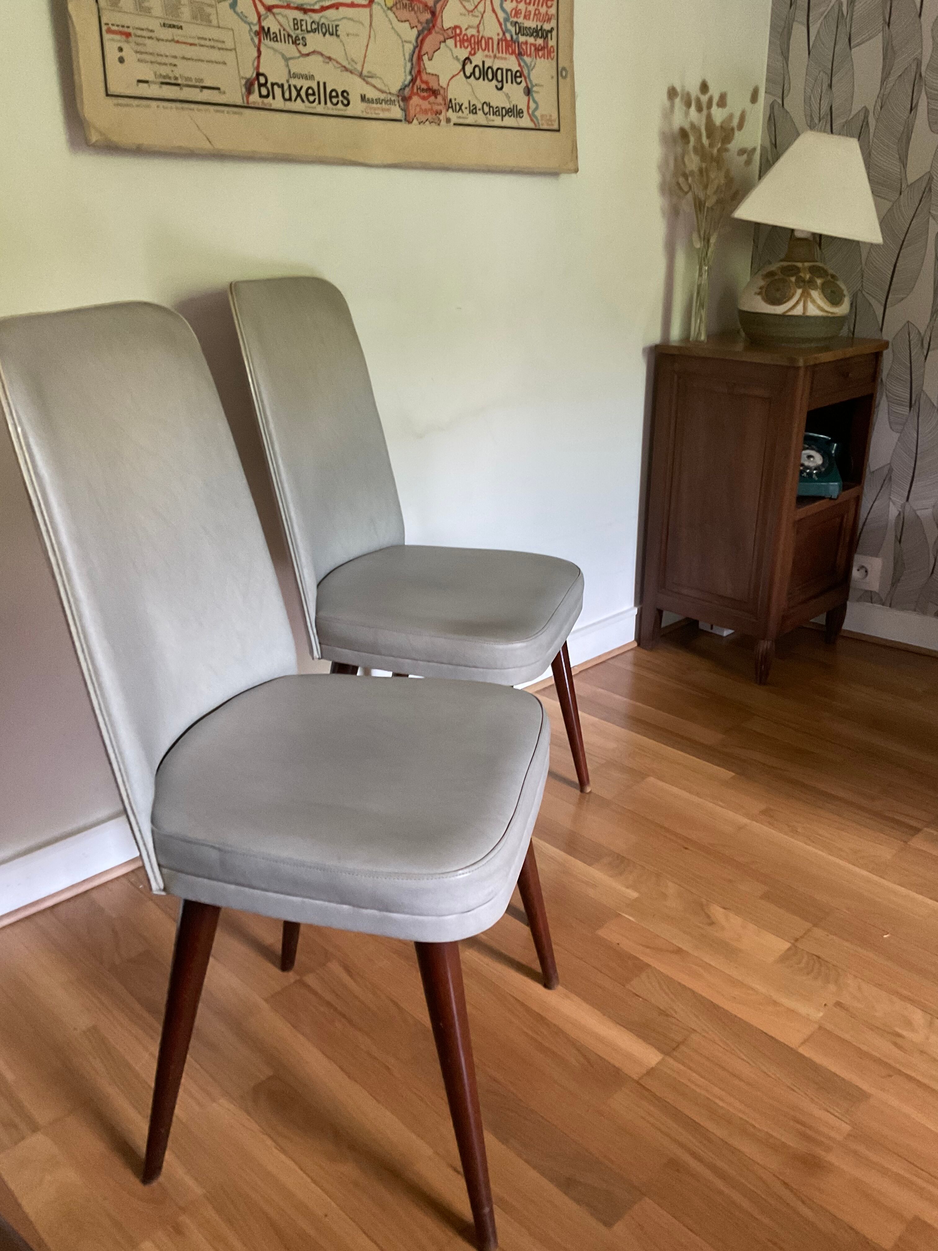 Pair of vintage mahogany and skai chairs