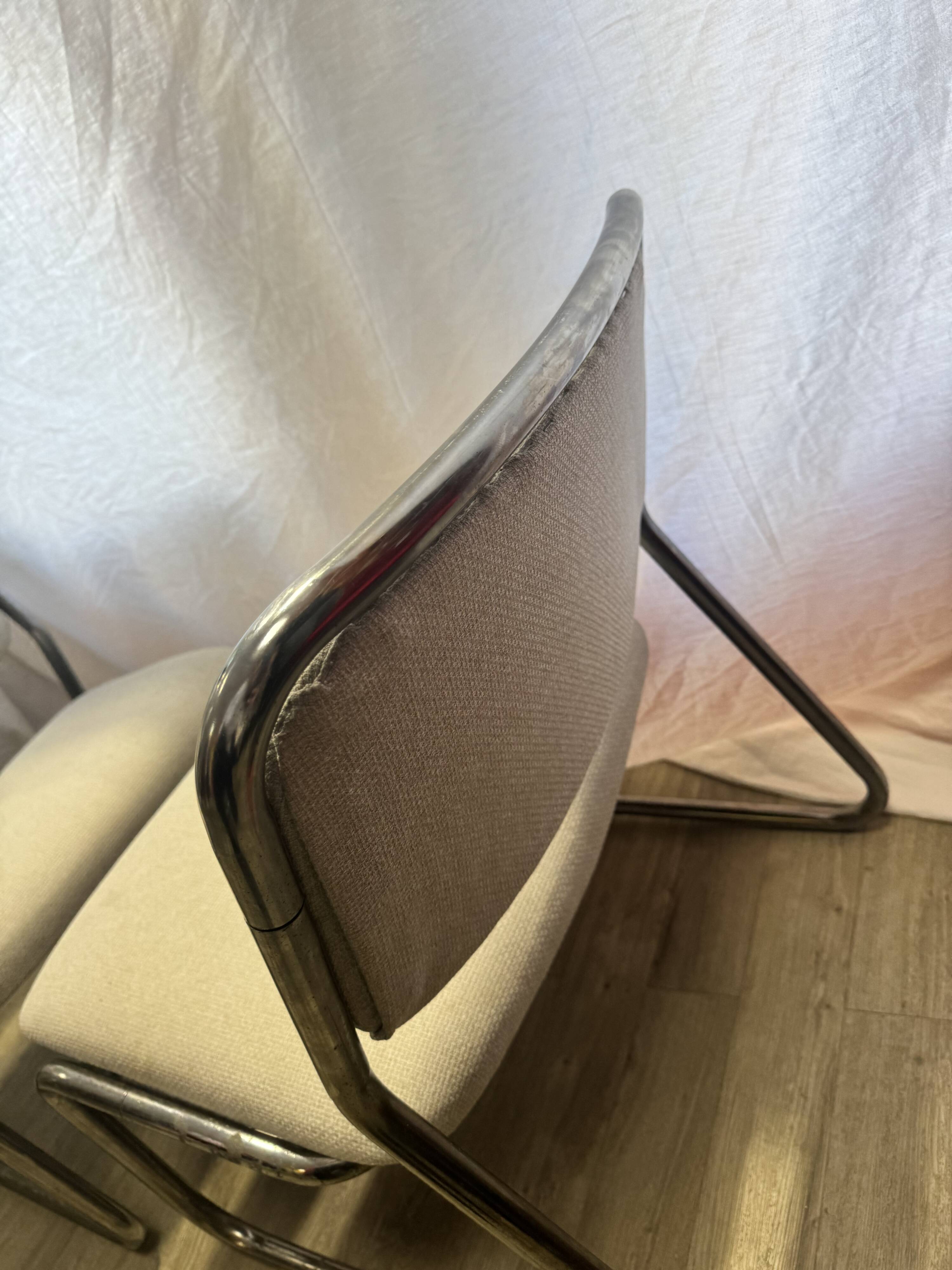 Pair of 70s tubular armchairs