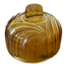 Honey-colored cheese bell in molded pressed glass from the 1930s