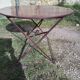 Outdoor table in garnet-colored metal