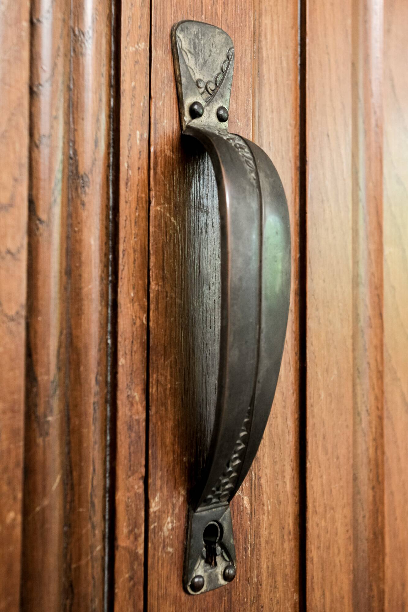 Old solid wood wardrobe with three vintage mirror doors