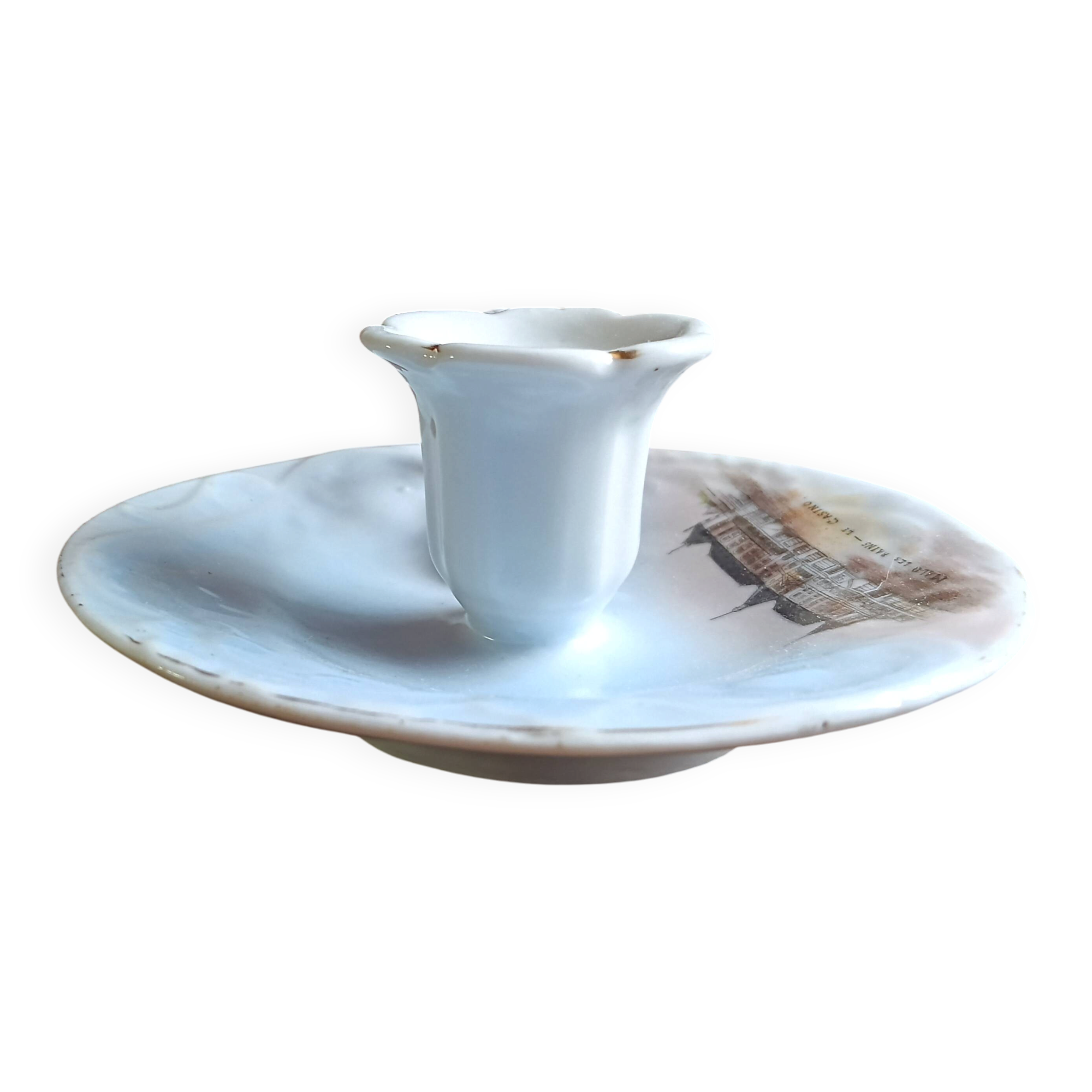 Antique handheld candle holder in porcelain