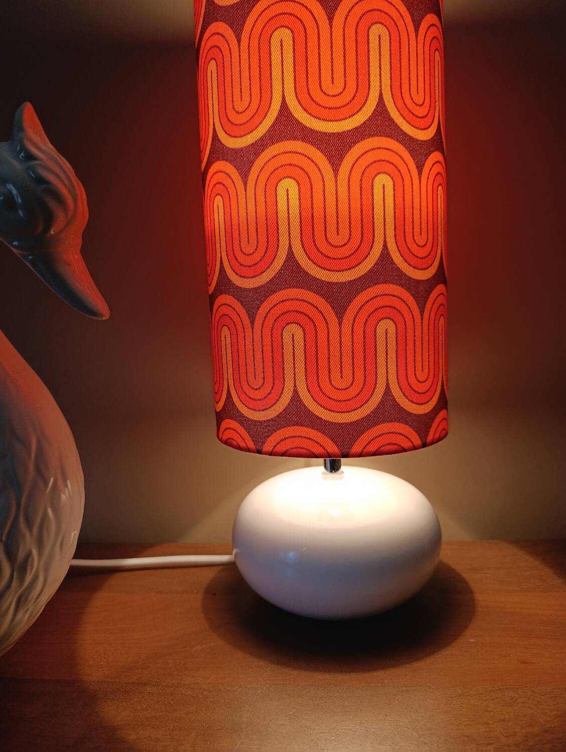 Two lamps with a seventies psychedelic wave print.