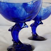 Set of 2 dolphin dessert cups in blue glass.
