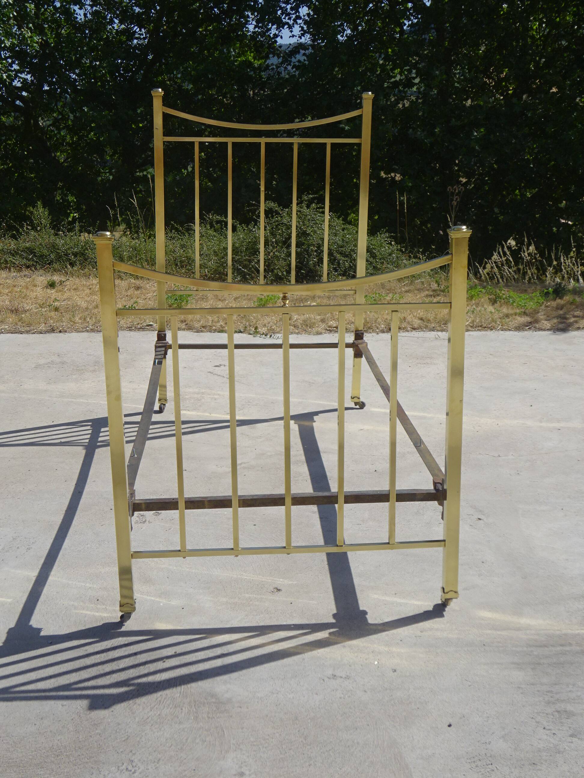 Antique gold-plated brass bed for one person.