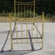 Antique gold-plated brass bed for one person.