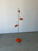 Three-spot floor lamp, Italian design, chrome and vintage orange.