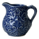 Old cream milk jug in slip