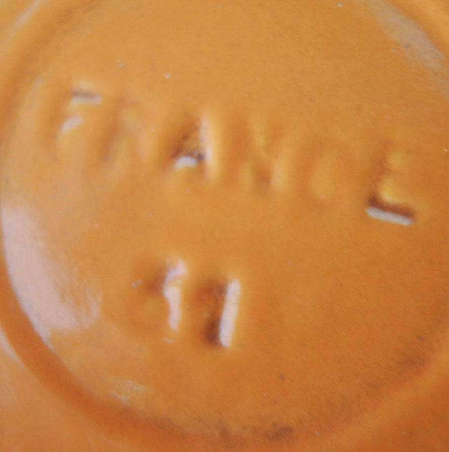 Nomar fondue service in orange cast iron