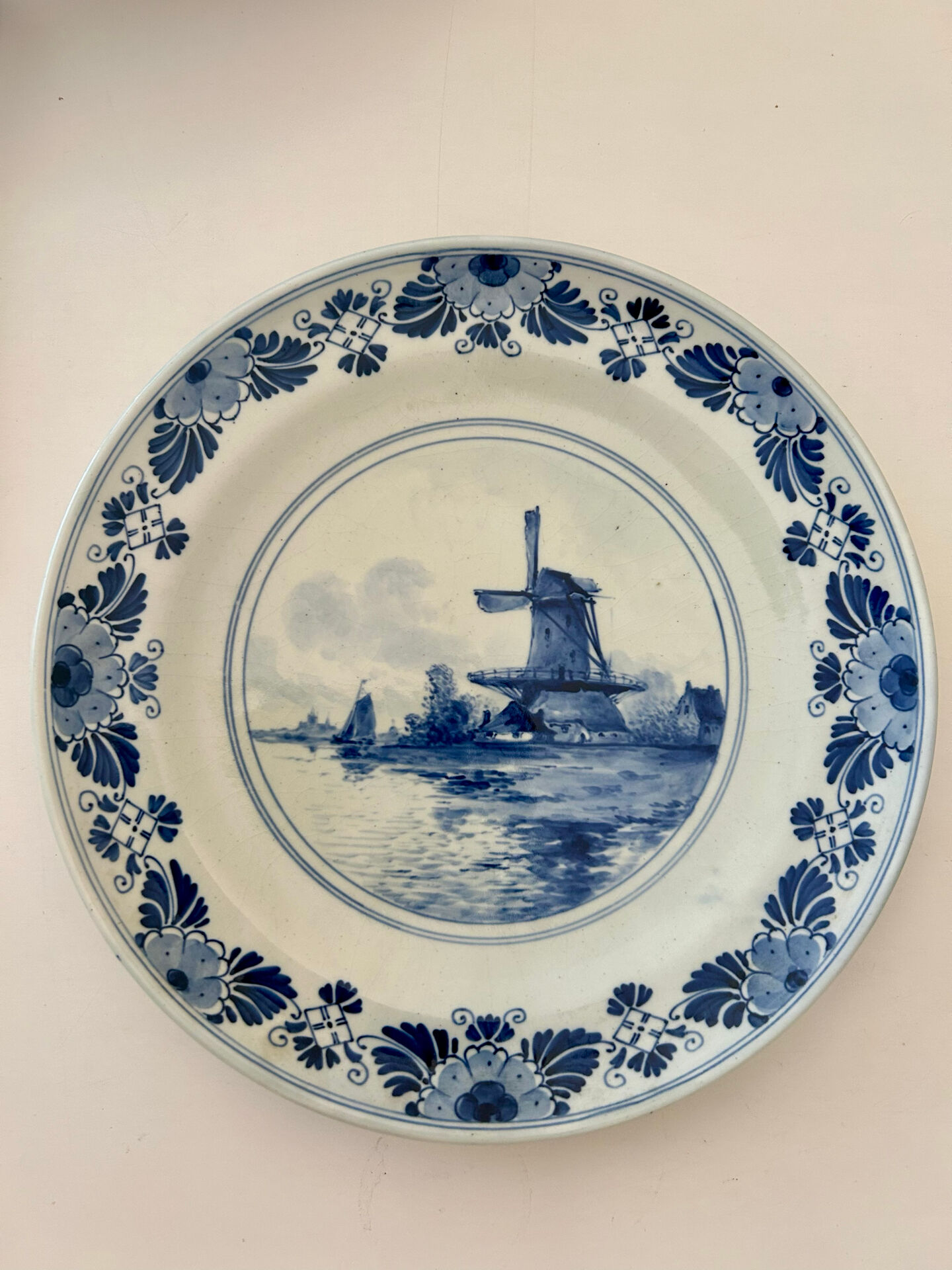 Old wall plate in blue Delft pottery