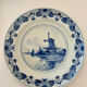 Old wall plate in blue Delft pottery