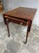 Antique drop-leaf side table on wheels