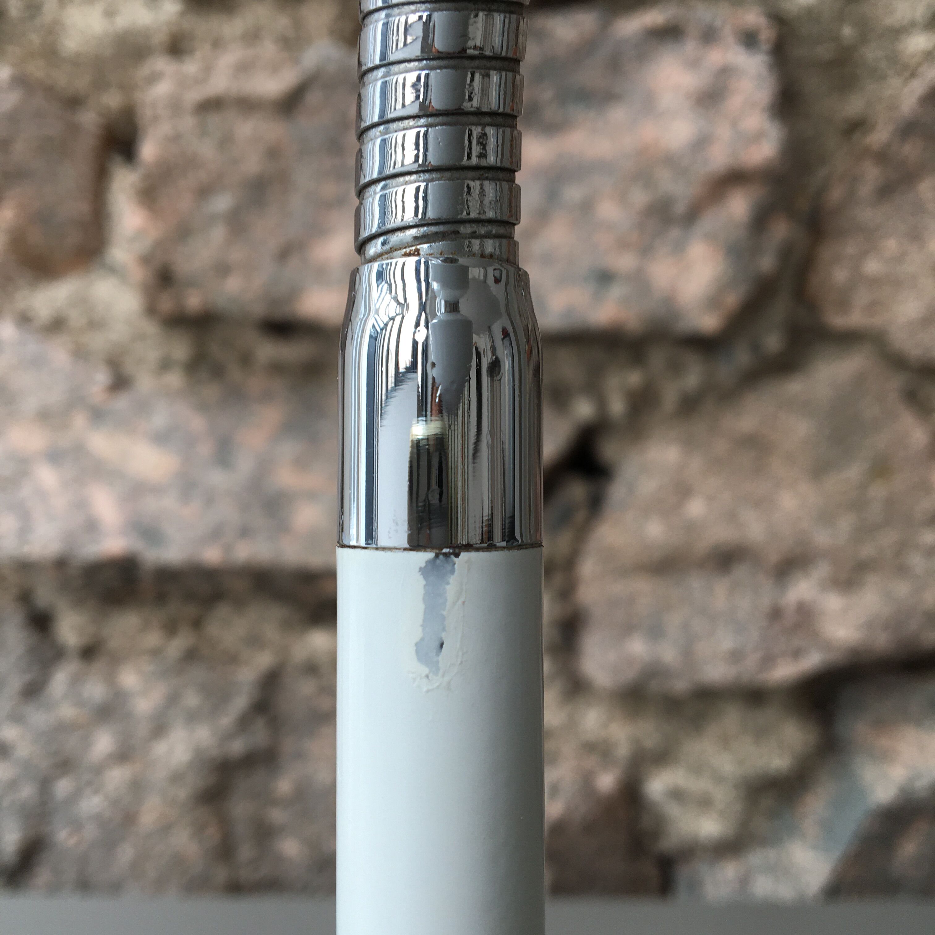 flexible white and stainless steel desk lamp