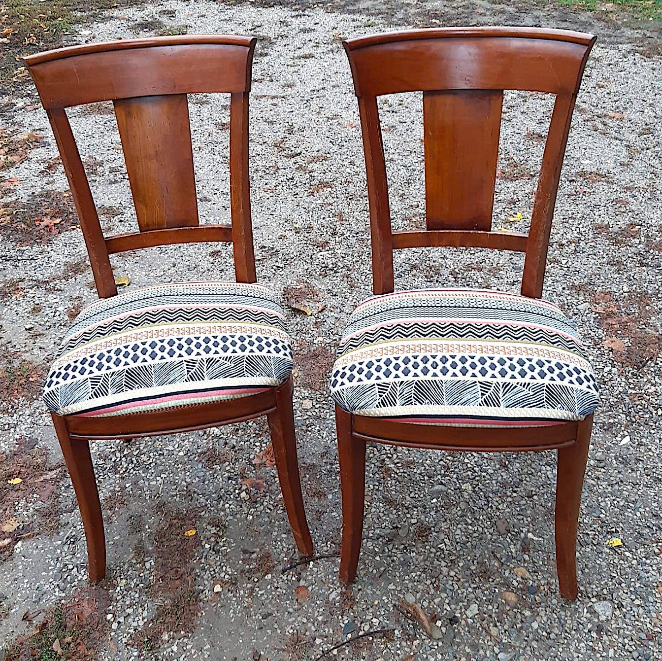2 varnished solid wood chairs with "ethnic" padding