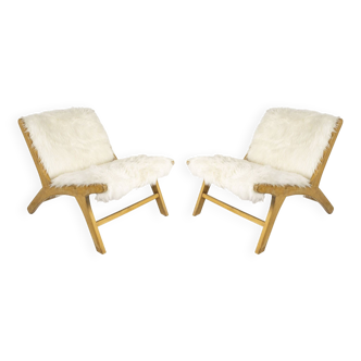 Pair of low chairs by olivier de schrijver
