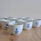 Teapot set and 9 cups with Chinese and French words