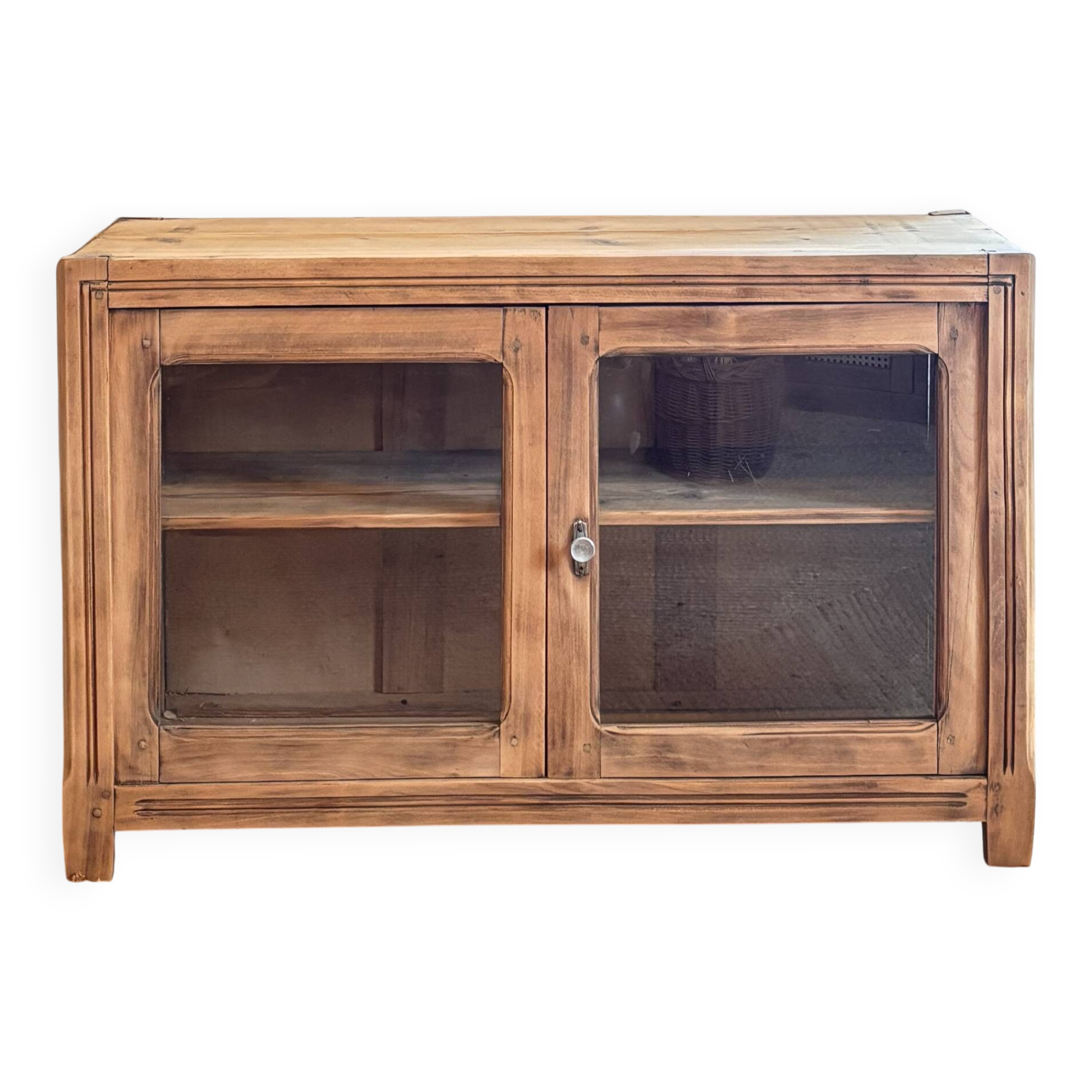 Old wooden buffet with a glass front in raw wood