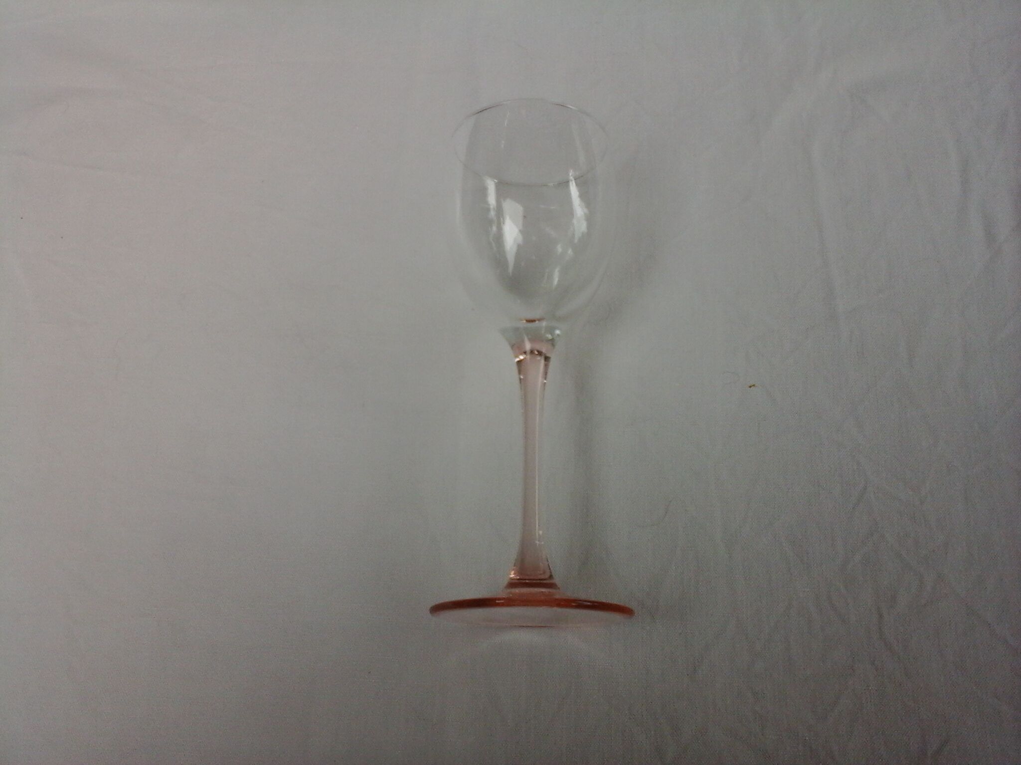 6 glasss of wine on pink foot