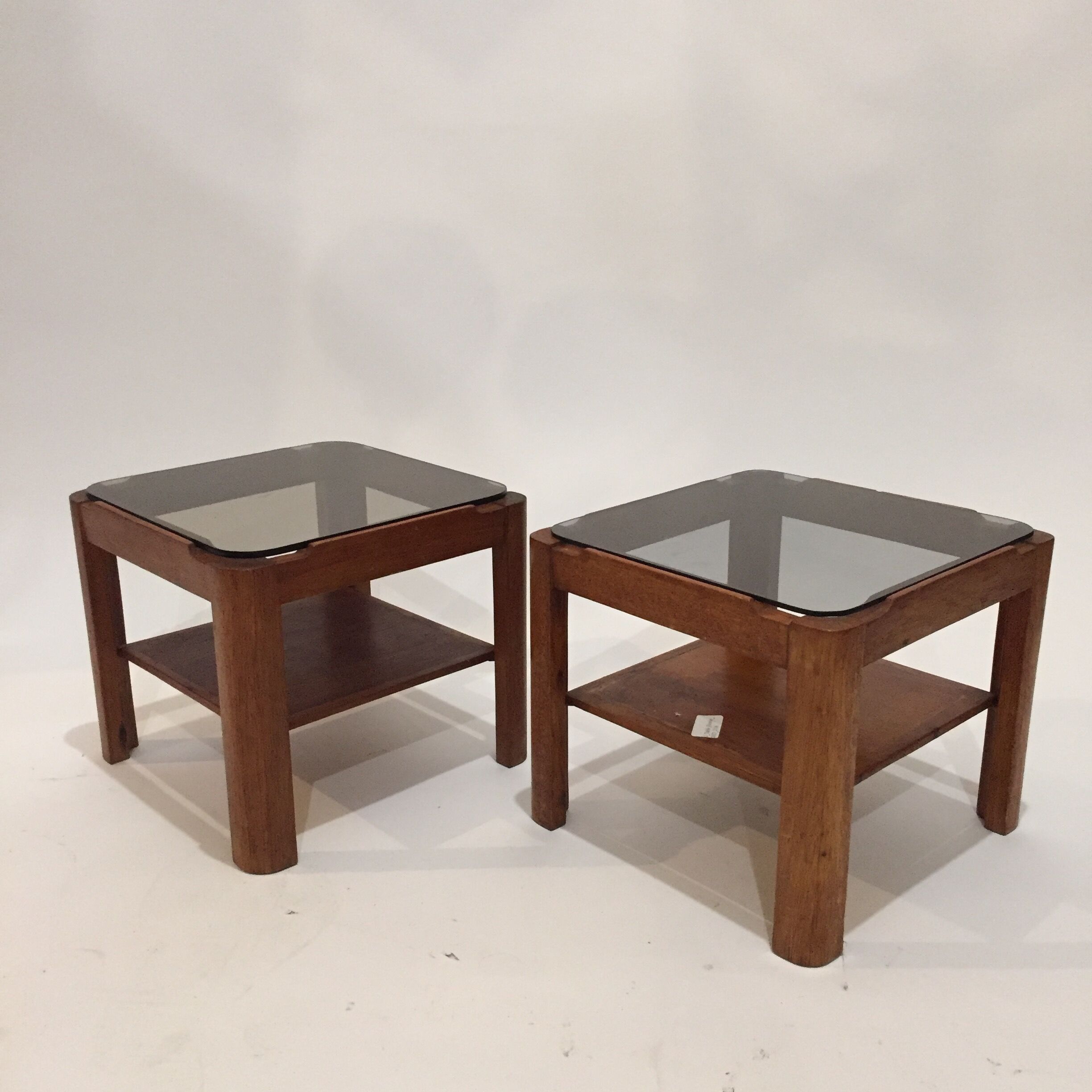 Pair of teak bedside tables and smoked glass