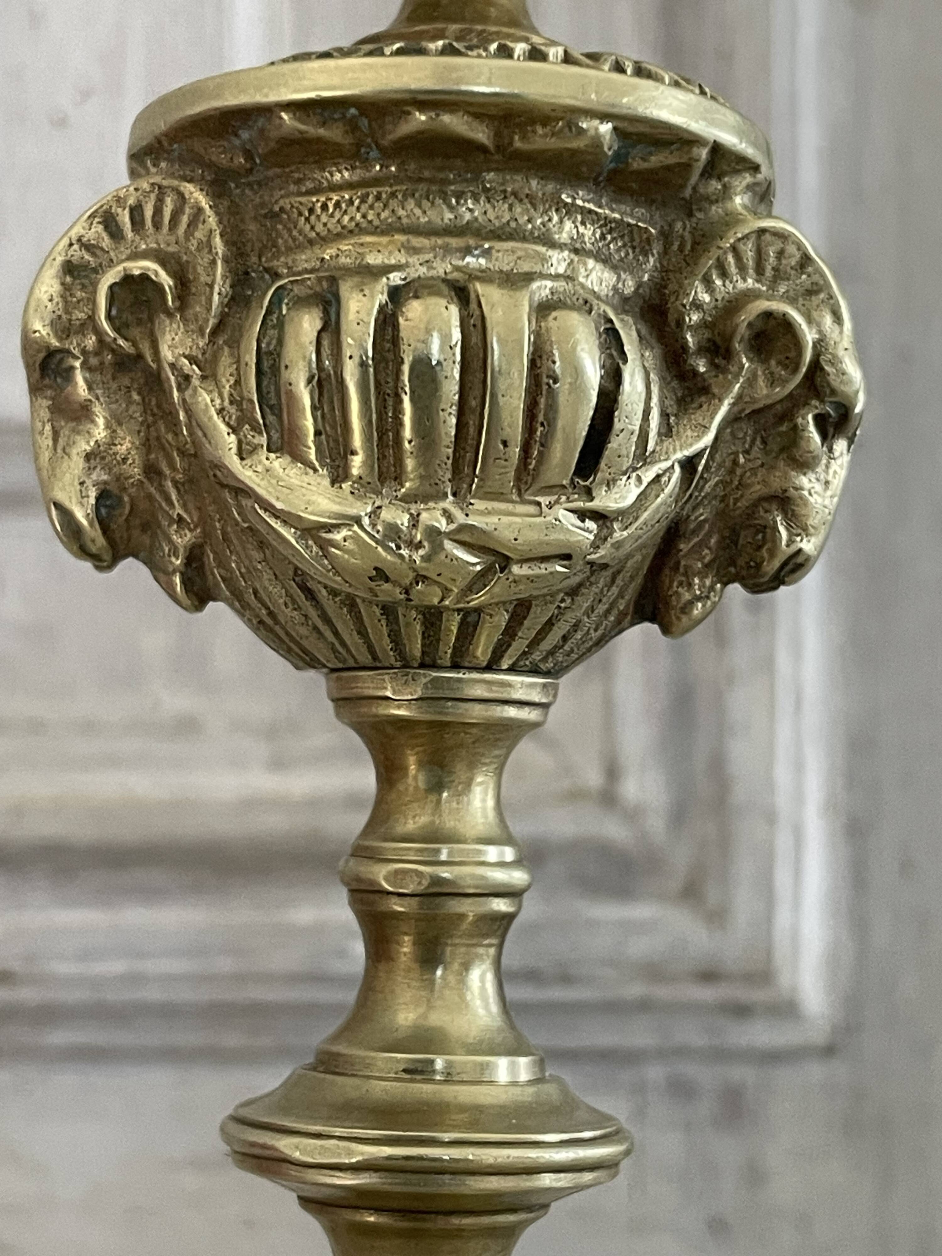 Pair of gilt bronze ram's head candlesticks, Louis XVI style, 19th century.