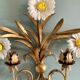 Wall lamp in gilded brass with a daisy design.