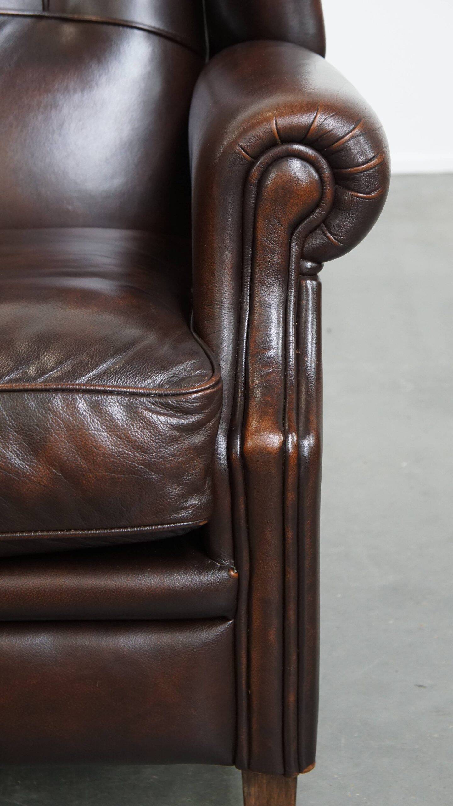 Very beautiful wing chair made of cowhide leather in English style