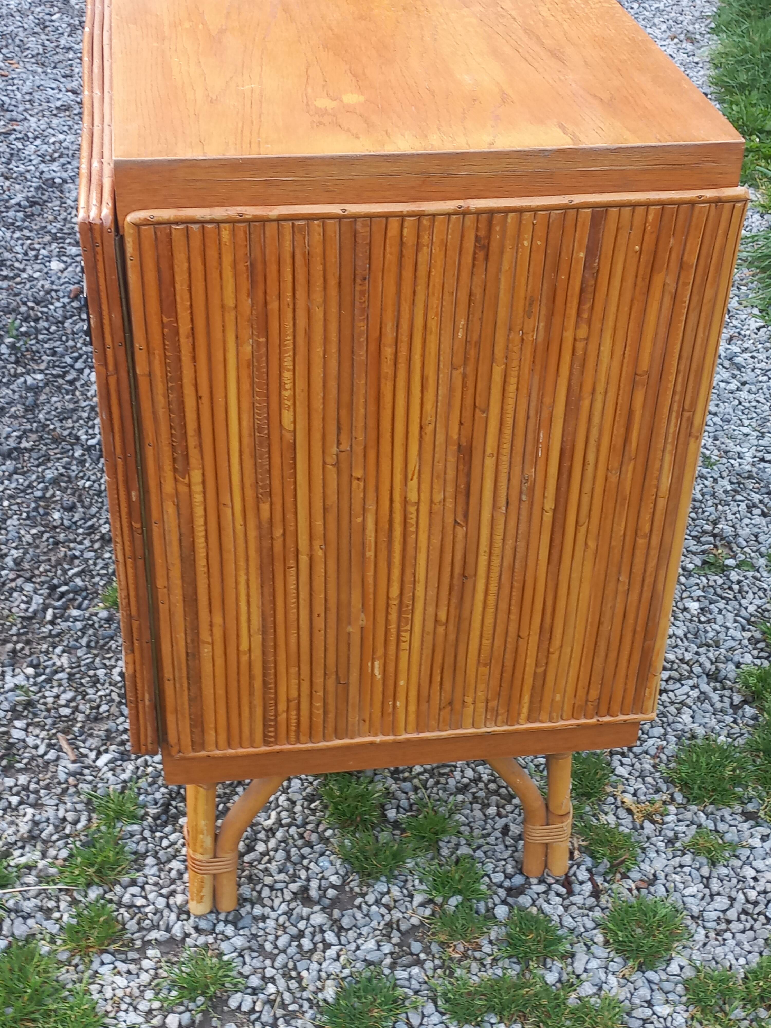Bamboo and rattan enfilade attributed to Audoux and Minet.