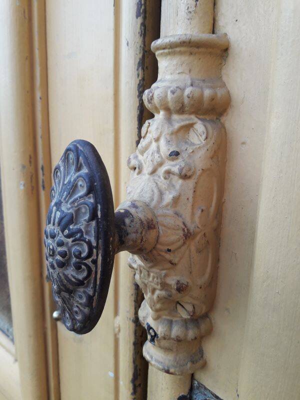 19th century double arched entrance door in oak with grilles and old glass